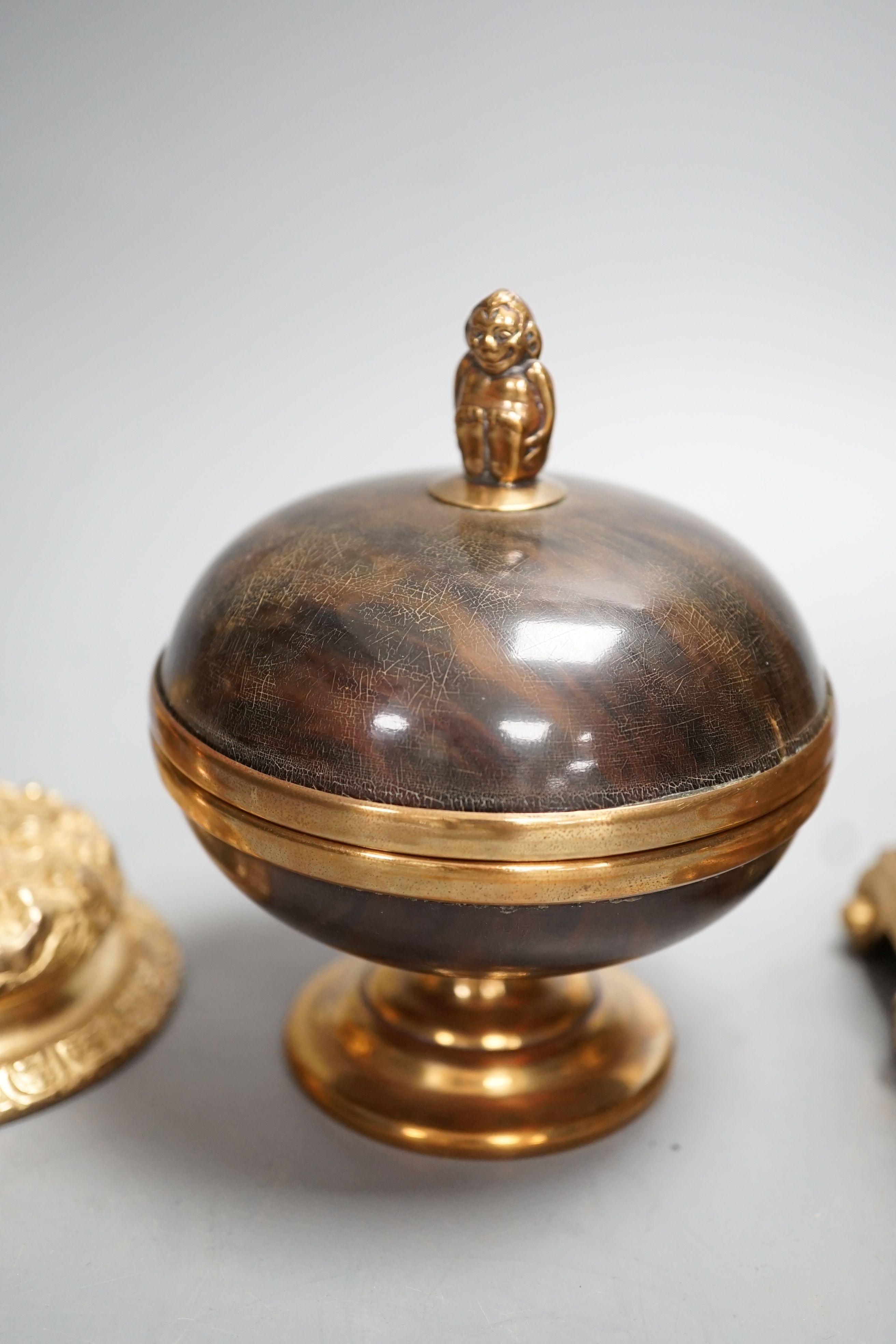 A decorative ormolu inkwell, 20cm high, a Baroque style candlestick, a chalice stamped W IV, together with a faux tortoiseshell pot (4)